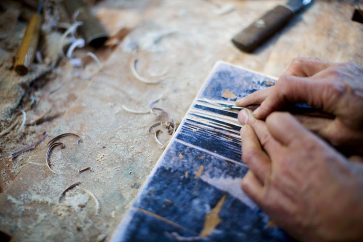 Brown carves a block for his Kearsarge from Eagle Pond.