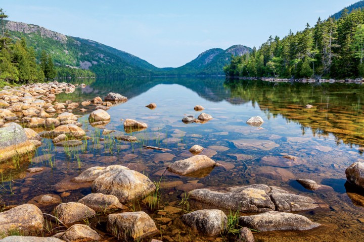 The tranquil beauty of Jordan Pond, with North and South Bubbles in the background, Acadia National Park, Mount Desert Island, Maine.