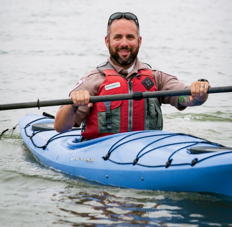 Massachusetts Conservation & Recreation ranger Corey Schiller kayaks between islands.