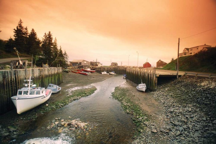 Ports on the Bay of Fundy along the New Brunswick and Nova Scotia coasts experience the greatest tidal range in the world. Some 115 billion tons of water flow in and out of Fundy in a 12-hour period.