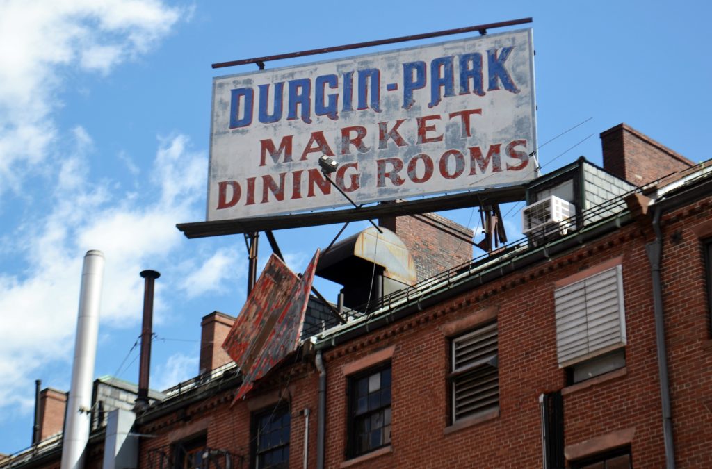 Billboard sign on rooftop for Durgin-Park, once a hallowed institution and now a paramount example of closed New England restaurants.