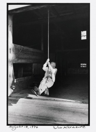White on the one-rope swing in his barn.
