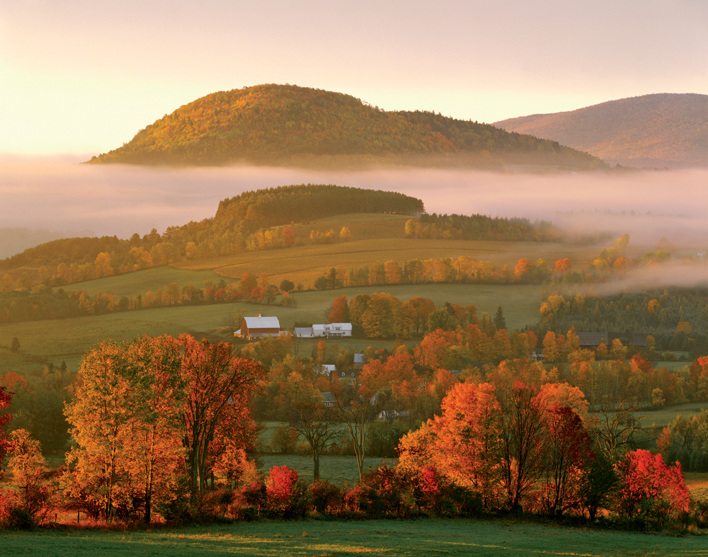 A misty fall sunrise amid brilliant autumn color in Peacham, Vermont. This is one of a series of images that photographer Richard Brown took when he first moved to Peacham 44 years ago. “As a fledgling professional photographer, I loved moments like these,” he says, “and felt very lucky to find them almost at my doorstep.”