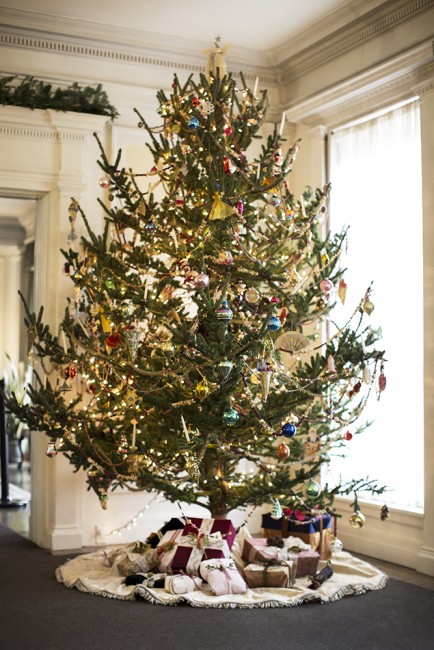 Vintage decorations adorn a christmas tree at Hildene.
