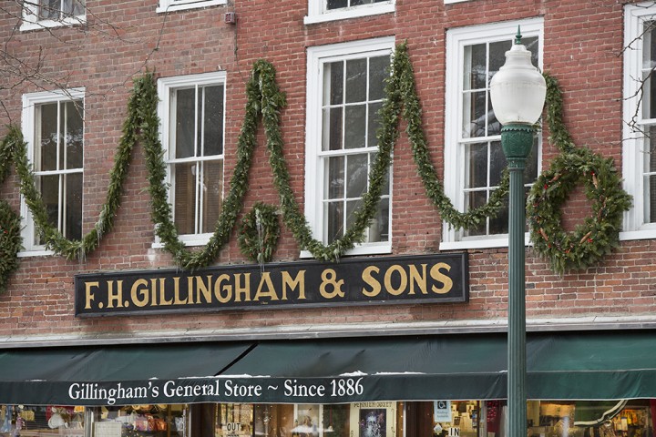 Simple holiday decorations adorn the storefront of F. Gillingham & Sons, a classic general store on Elm Street in Woodstock since 1886.