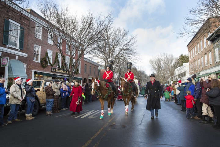 Woodstock's annual Winter Wassail Parade features horses and riders in traditional costumes.