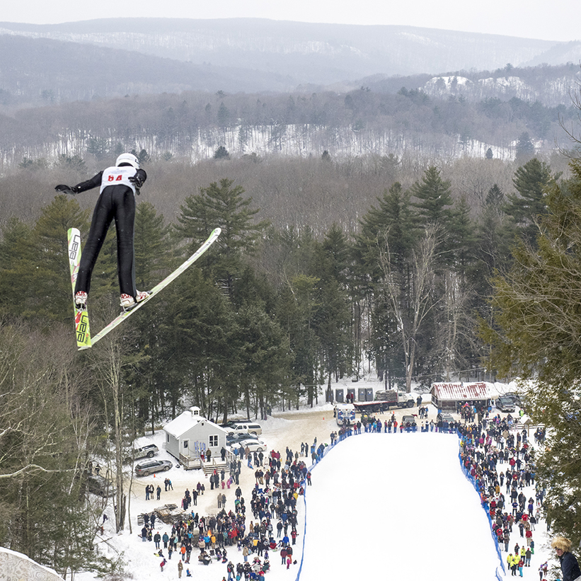 A participant takes flight at the Satre Hill Ski jump.