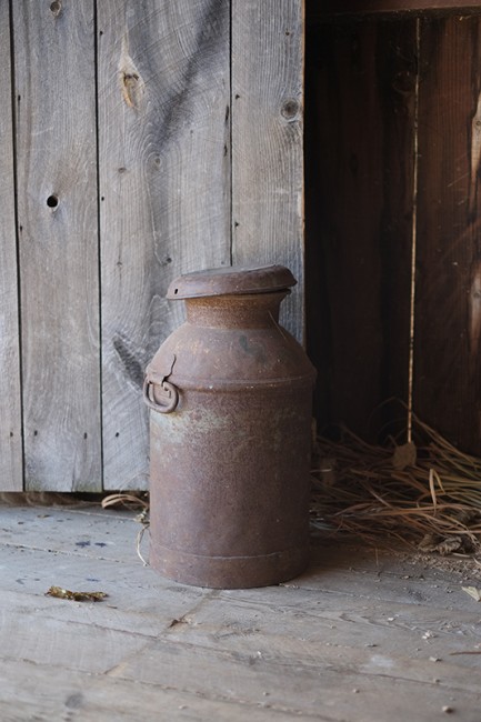 A weathered milk bucket in the main entrance to the Round Stone Barn, c. 1826.