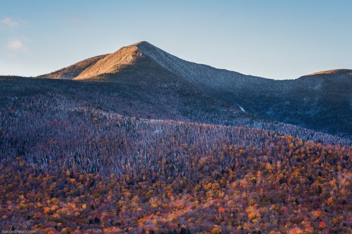 Snow fell across much of Northern New England this past weekend, stripping much of the color in the mountains.