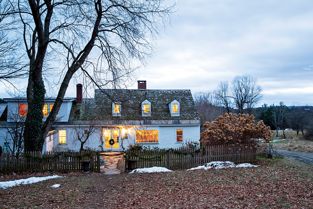 Kristin & Mark’s 18th-century farmhouse is aglow with holiday warmth in the late-afternoon light.