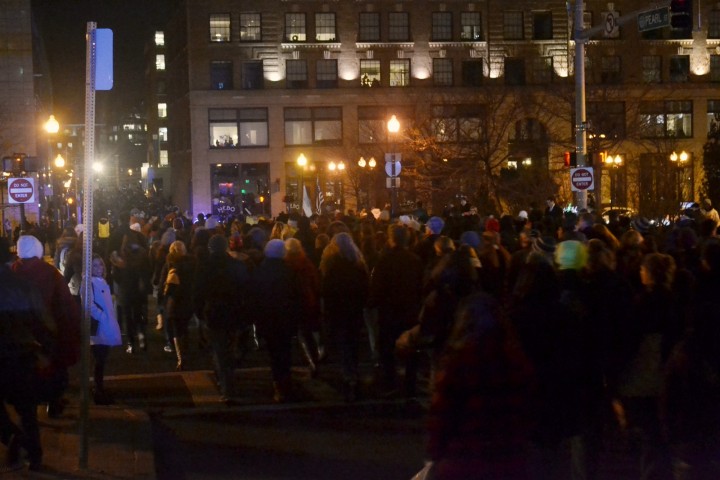 The crowd takes to the streets to make their way down to the waterfront. 