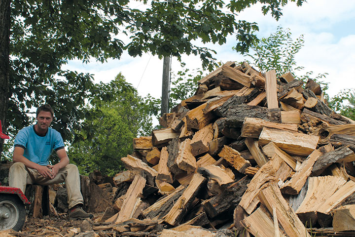 The author’s husband and her new batch of firewood. 