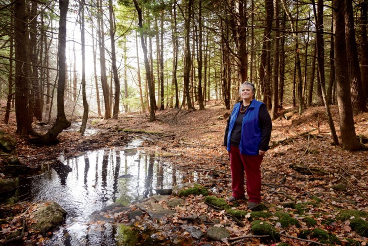 Carolyn Sellars at “The Spot,” a stream-fed grove on her family’s farm in Winchendon, Massachusetts. She has successfully defended this property from a number of proposed commercial developments and projects over the years, including Kinder Morgan’s pipeline, but now faces a challenge to her land in Townsend. 