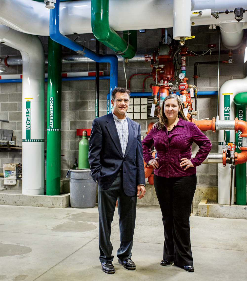Tim Shea, chair of the energy advisory committee in Montpelier, Vermont,  and assistant city manager Jessie Baker at the Vermont District Heat plant.