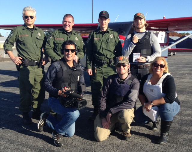 On location at the Sanford airport with the North Woods Law cast and crew. Back row: Spahr, Richardson, Beach and Posey. Front row: Hernandez, Given and Wigglesworth.