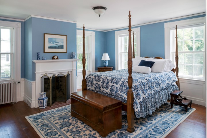 The master bedroom, with one of the home’s eight fireplaces.