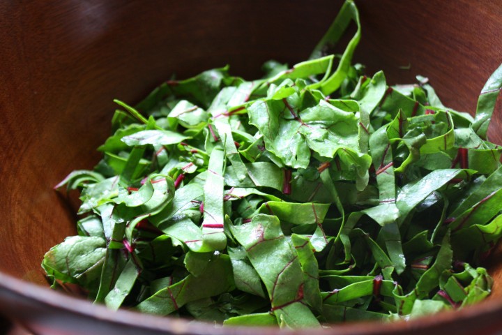 Slice beet greens crosswise into thin ribbons