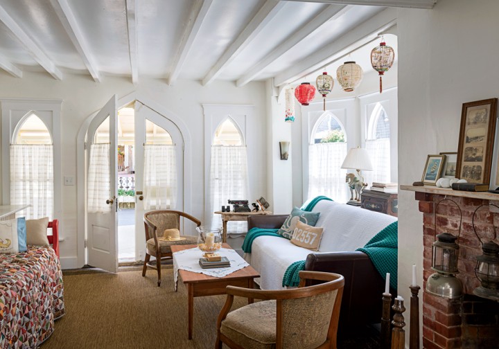 Carpenter Gothic–style French doors and windows—and paper lanterns from Illumination Nights past—lend the living room unique charm.