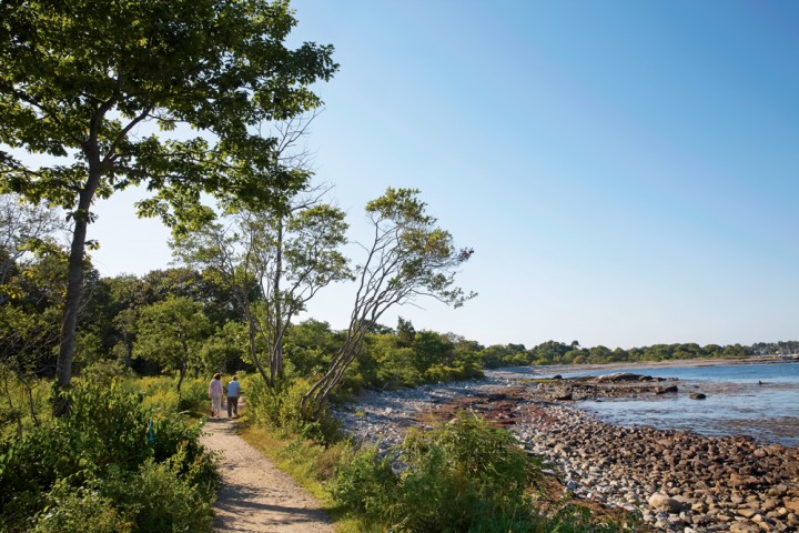 In Odiorne Point State Park, Rye, late-afternoon visitors stroll Monument Way along a rocky stretch just northwest of the Seacoast Science Center.