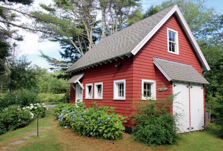 The red barn behind the house, recently built, serves as a guesthouse and storage site.