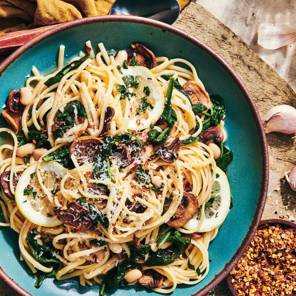 https://newengland.com/wp-content/uploads/2023/08/mushroom-white-bean-spinach-garlic-scampi-960x960.jpg