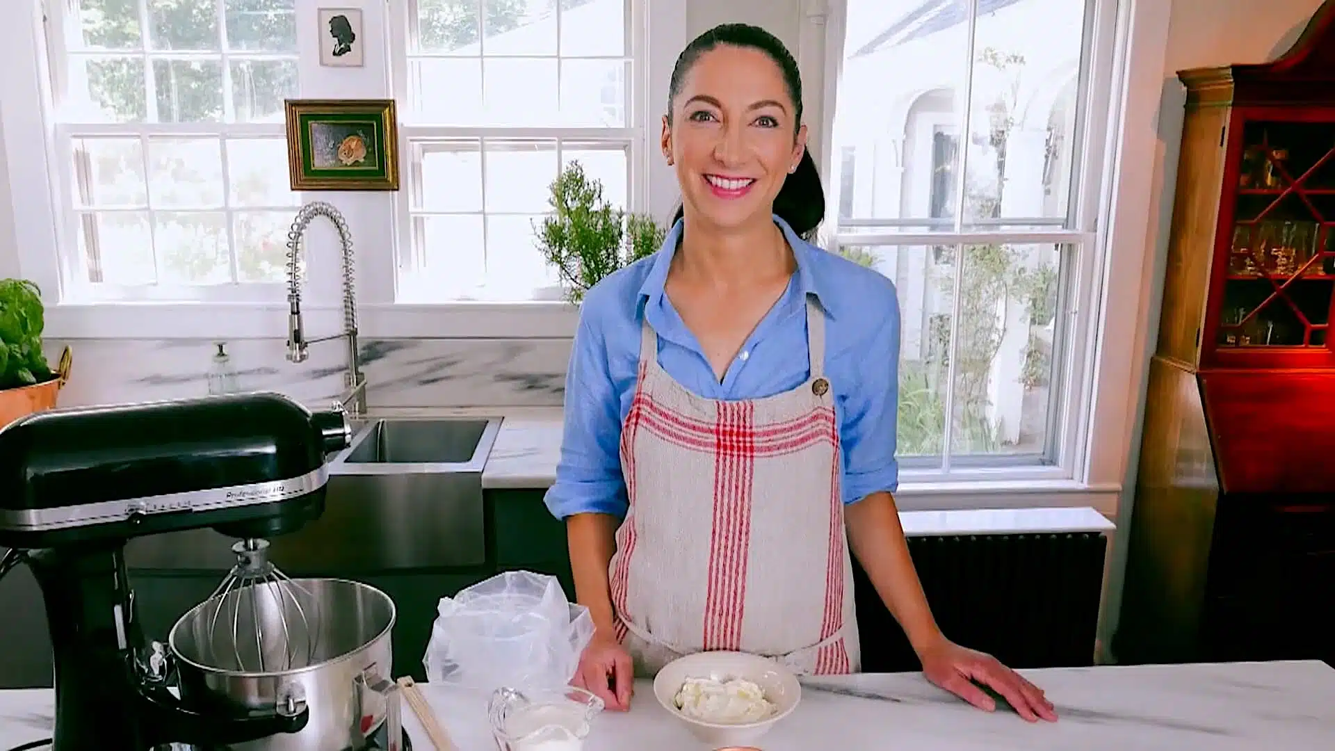 Gesine Bullock-Prado standing at a counter.