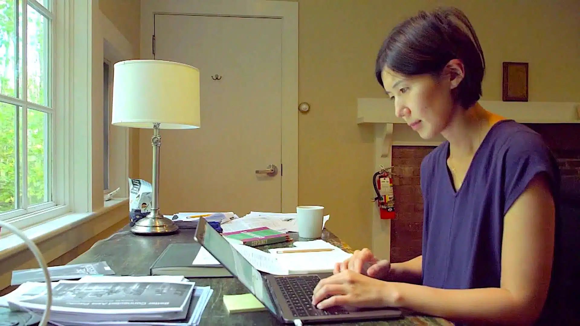 Author writing at the Macdowell colony