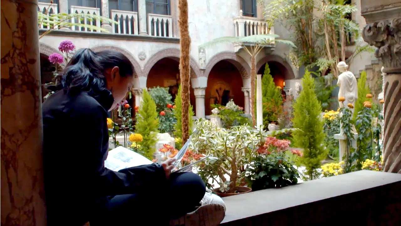 Person reading at the Isabella Gardner Museum.