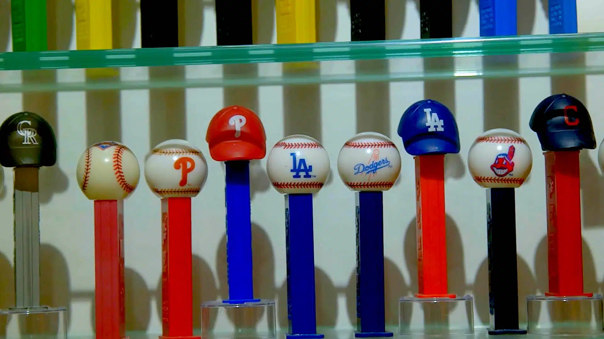 PEZ dispensers displayed in a row.
