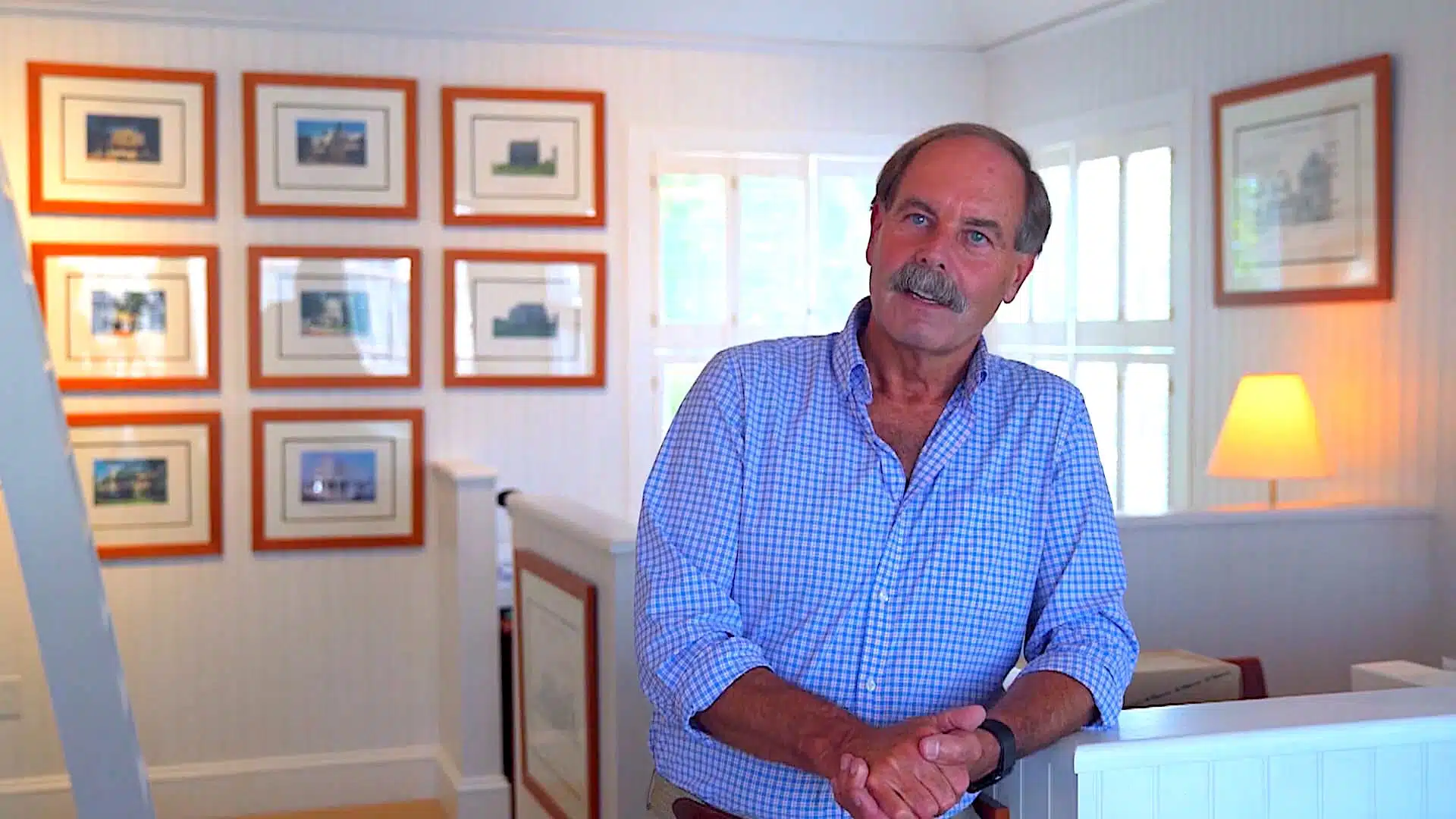 Patrick Ahearn leaning on a banister.