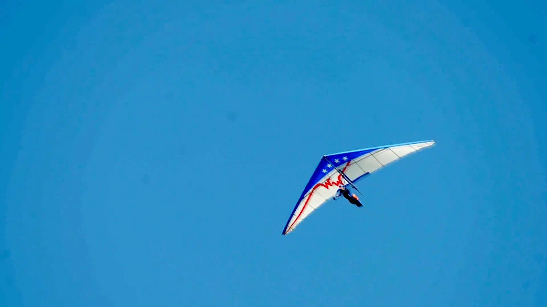 person hang gliding.