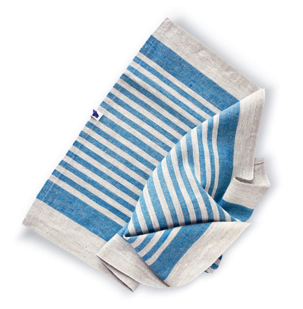 A folded blue and gray striped cloth with a white and blue tag attached. The stripes vary in thickness.