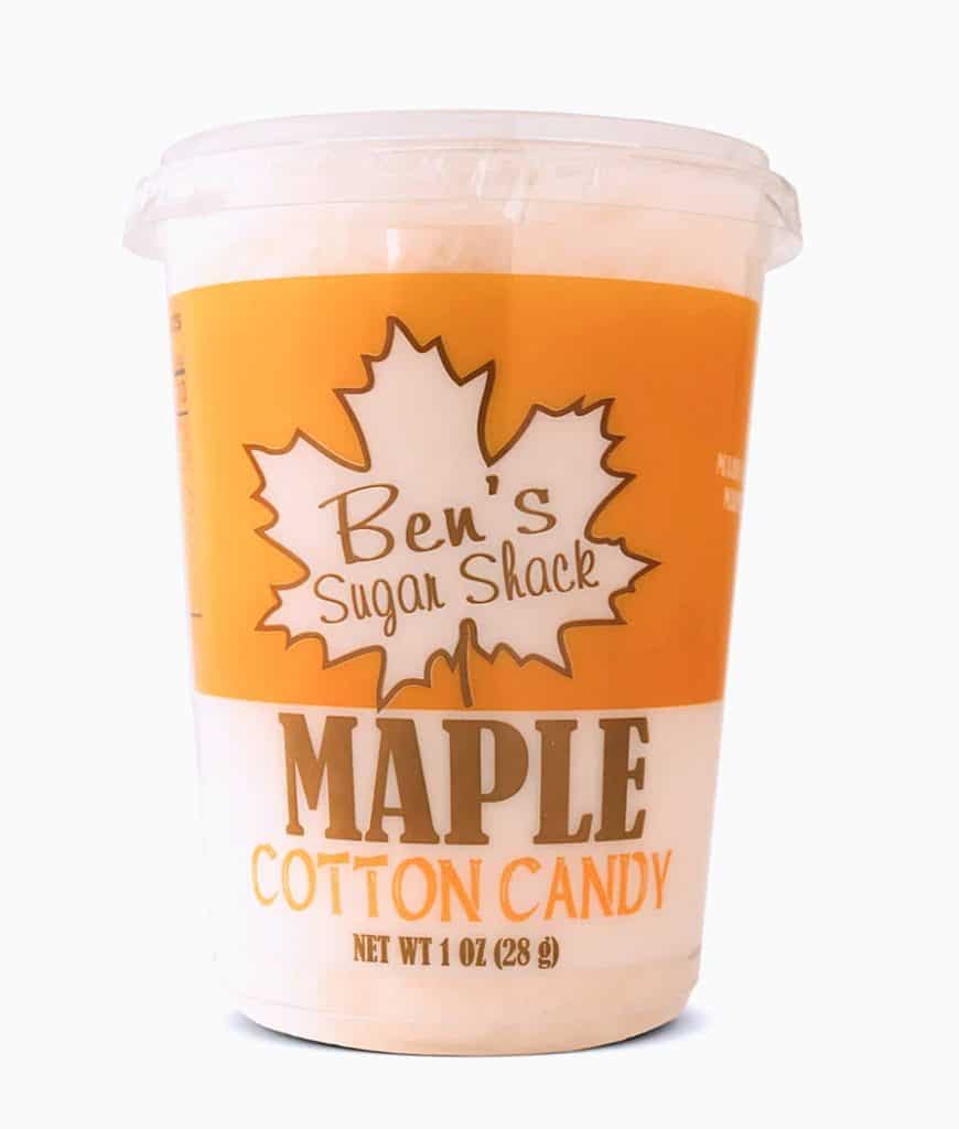 A container of Ben's Sugar Shack maple cotton candy, 1 oz (28 g), with a maple leaf design on the label.