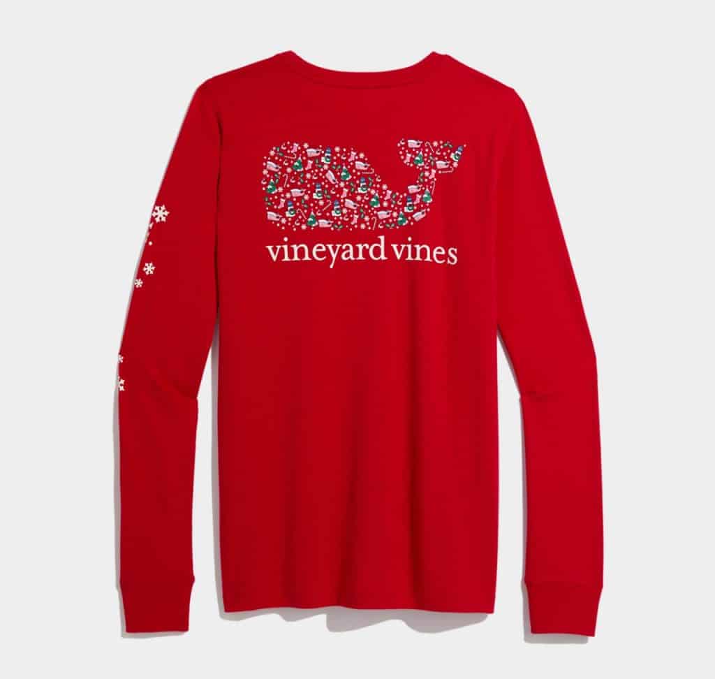 Red long-sleeve shirt featuring a patterned whale logo and the text "vineyard vines" on the back, with small designs on the sleeve.