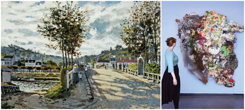 A person views an abstract mixed-media wall sculpture in a gallery; next to it is a painting of a street scene with trees and people under a cloudy sky.