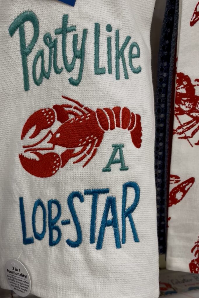 A towel with the phrase "Party Like A Lob-Star" at Renys in Maine