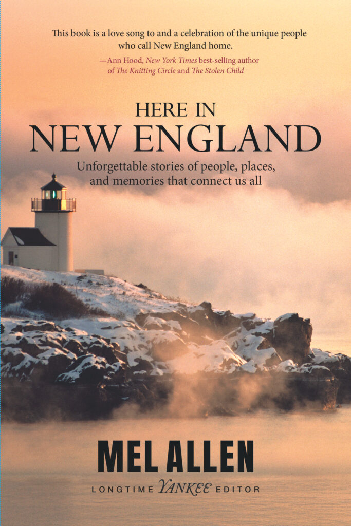 A coastal lighthouse sits on rocky shore under a misty sky. Text reads “Here in New England” by Mel Allen, with a quote and description above the author’s name.
