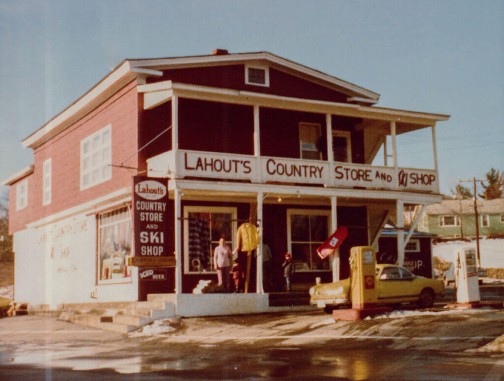 Lahout's Ski Shop in Littleton, New Hampshire. A vintage photo of Lahout’s Country Store and Ski Shop with mannequins and a yellow car outside.