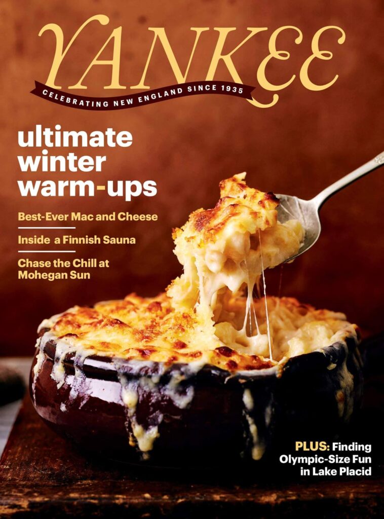 A fork lifts cheesy mac and cheese from a browned dish on the cover of Yankee magazine.