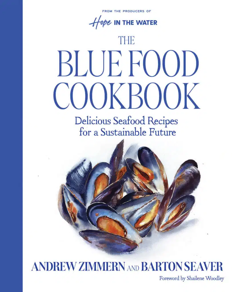 Book cover for "The Blue Food Cookbook" with a watercolor illustration of mussels in shells.