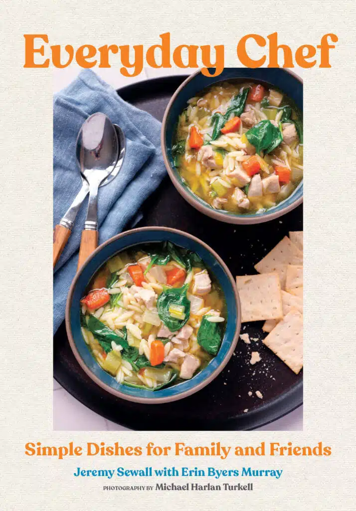 Book cover for "Everyday Chef" with that shows two bowls of vegetable soup with crackers on a tray, with spoons and a blue napkin beside them.