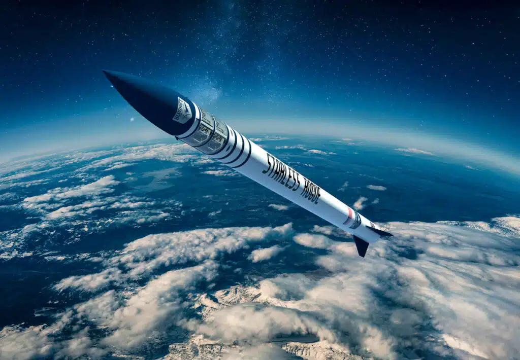 A rocket labeled "SPACE ROCKET" flies above Earth’s clouds, heading toward space under a starry sky.