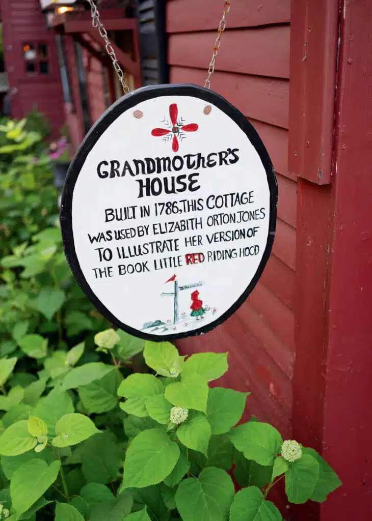 Pickity Place in New Hampshire. Round sign reading: "Grandmother’s House, built in 1786, used to illustrate Little Red Riding Hood.