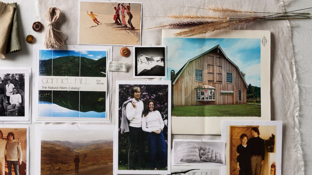 A collage of vintage photos, fabric swatches, buttons, and dried grasses arranged on a textured white surface.