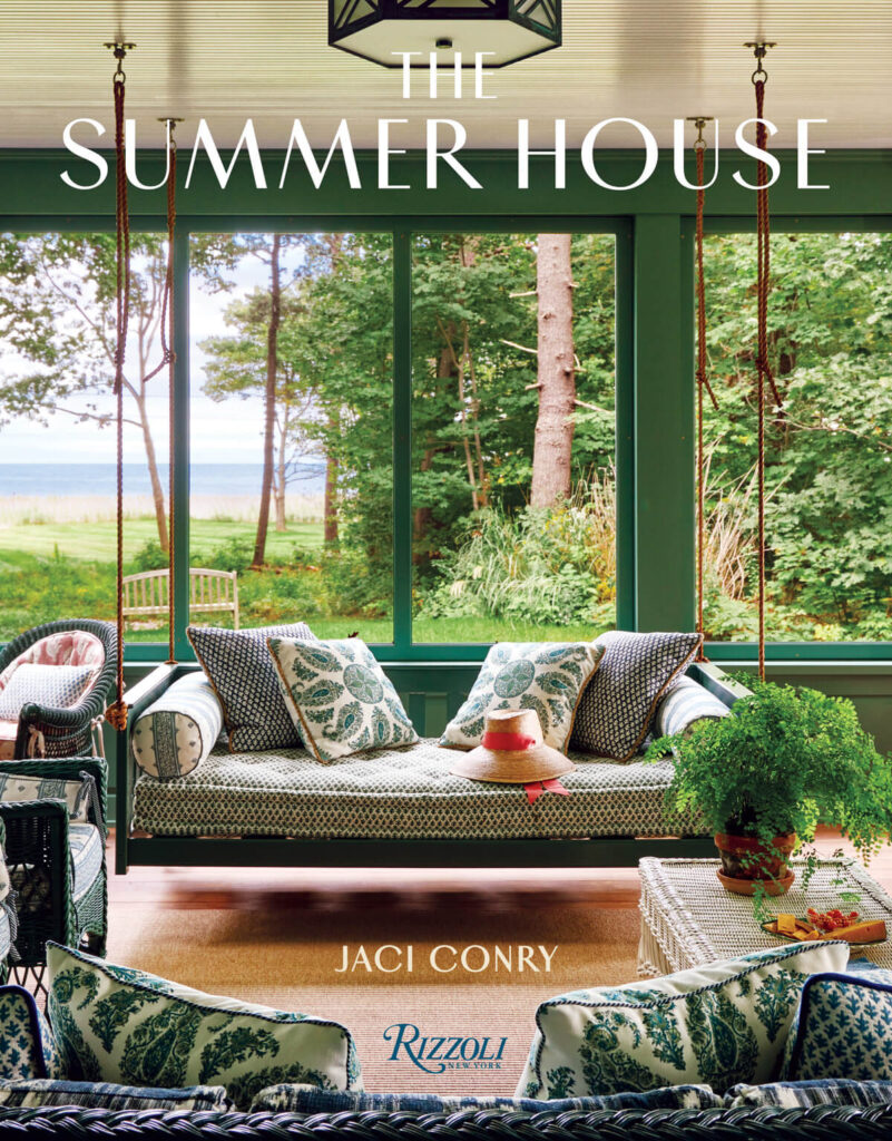 Book cover with a porch swing, green decor, and garden view; text reads "The Summer House" by Jaci Conry.