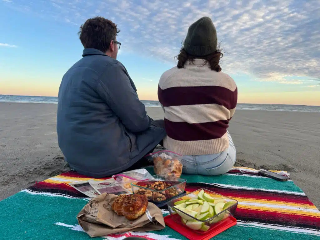 An autumn picnic on Higgins Beach in Maine is perfect if you dress right in affordable fall layers from Renys.