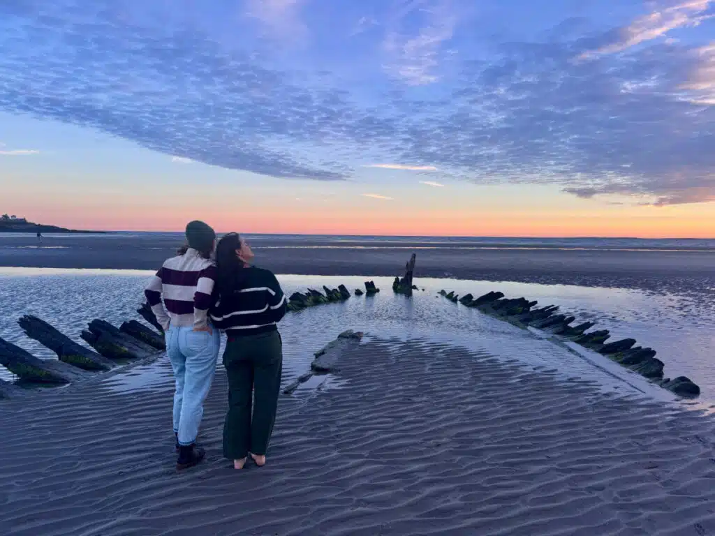 Photogenic fall apparel from Renys makes scenes like this shipwreck on Higgins Beach appear even more Maine.