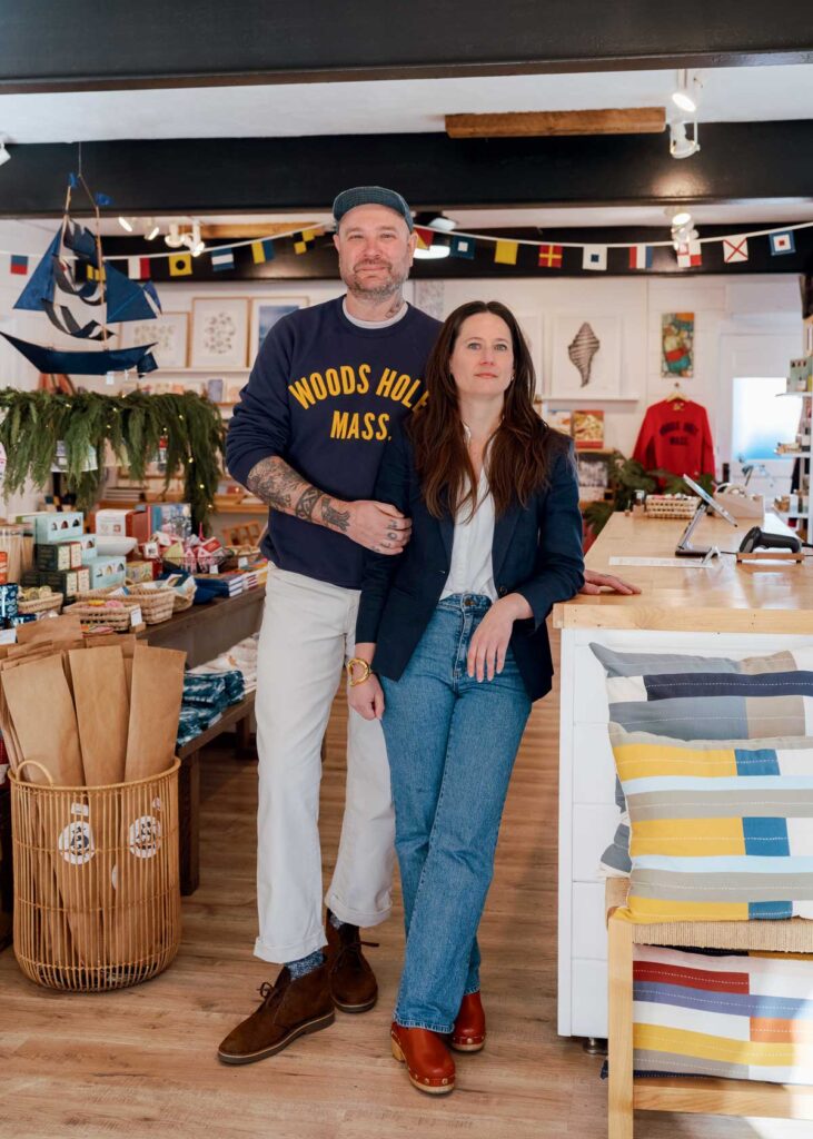 A man and a woman standing together inside a shop.