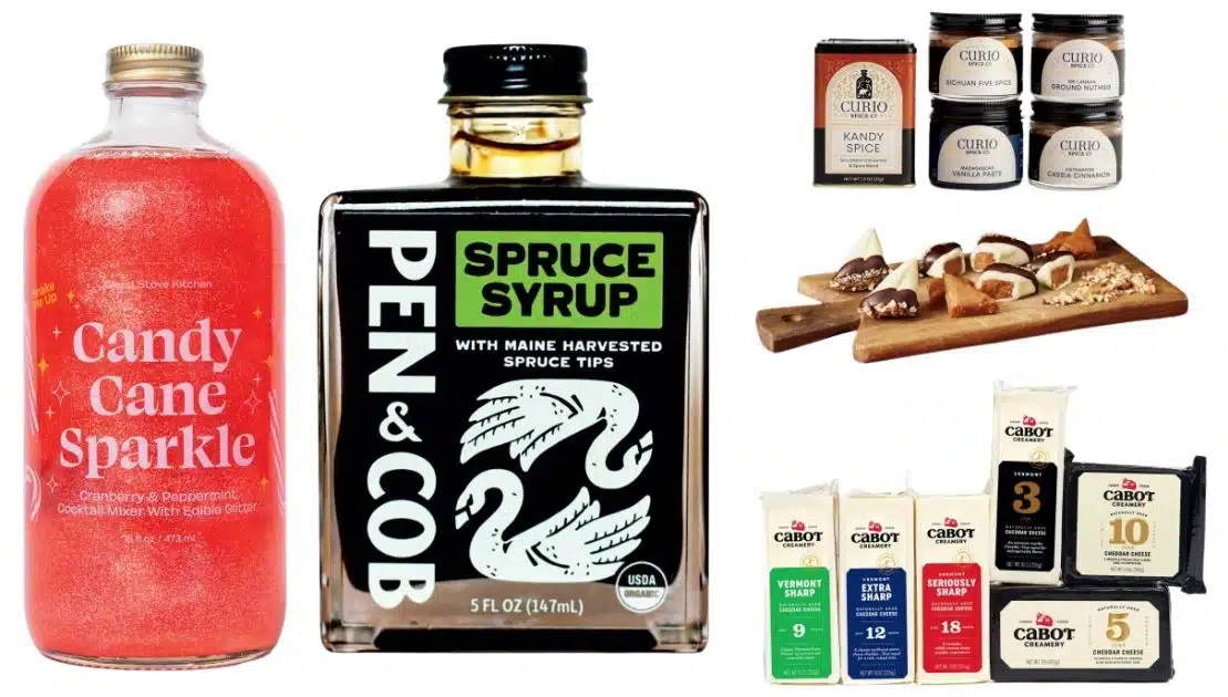 A collection of food products including Candy Cane Sparkle cocktail mixer, spruce syrup, spice jars, and cheddar cheese.