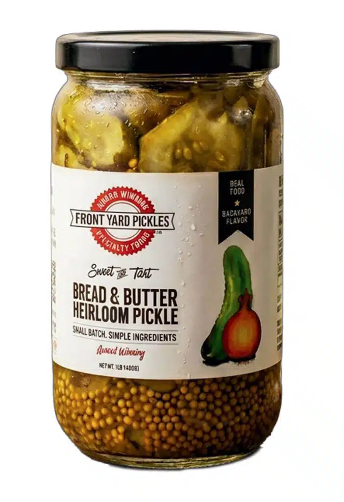 A glass jar of Front Yard Pickles Bread & Butter Heirloom Pickles.